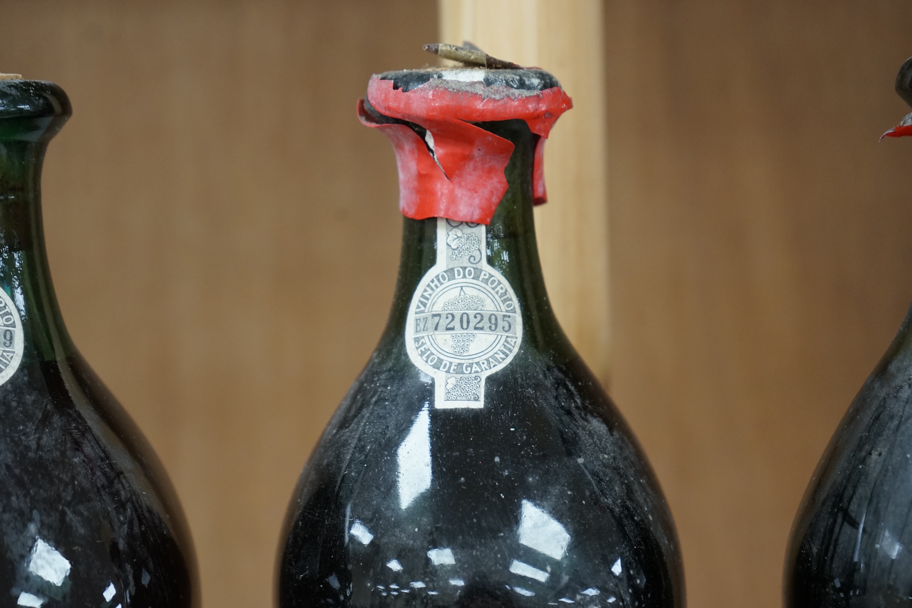 Three bottles of Porto Dalva house reserve port, comprising; 1934, 1940 and 1941. Condition - fair, some wear to labels and seals, etc.